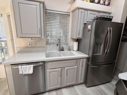 After with a 30" dishwasher and new countertops.  We painted the cabinets