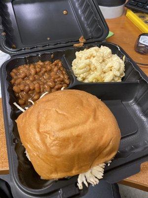 Clumpy water n cheese with stale bun on sandwich and canned beans