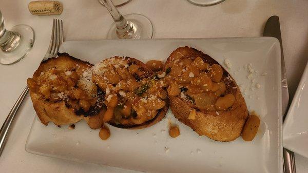 Bruschetta e fagioli - grilled local brick oven bread brushed with extra virgin olive oil and warm Tuscan Beans