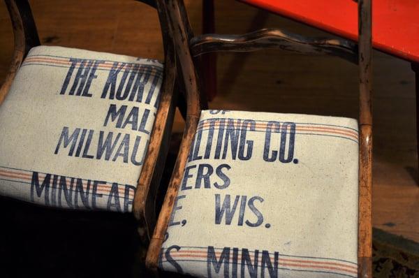 Vintage dining chairs in heavy feed sack..