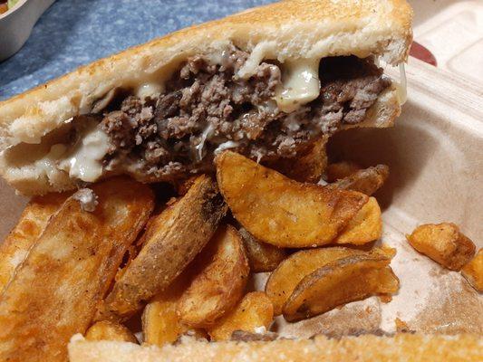 Swiss mushroom burger with fries. Bread tasted like cleaning chemicals and the meat was dry.. Totally inedible.