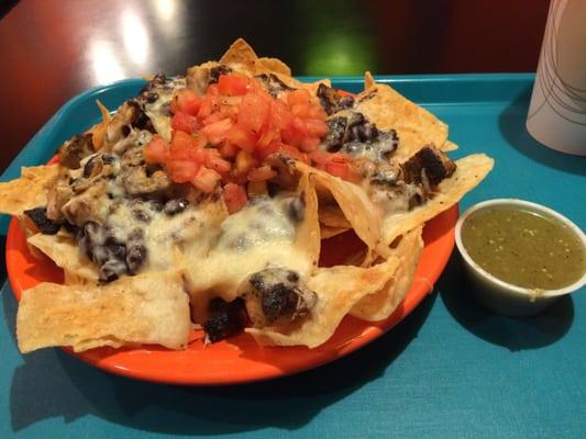 Nachos w pollo asado and delish salsa verde