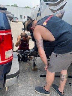 Adam and Ben working to get our new hitch adjusted.