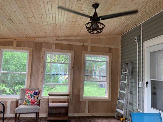 inside of deck with completed ceiling, walls and windows.