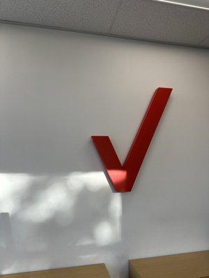 Verizon logo inside by the benches