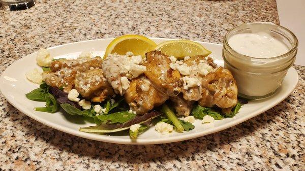 Greek wings with lemon and feta cheese.