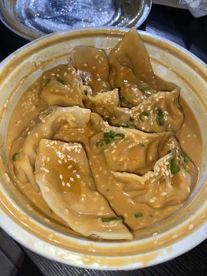 shrimp dumplings in spicy sesame sauce