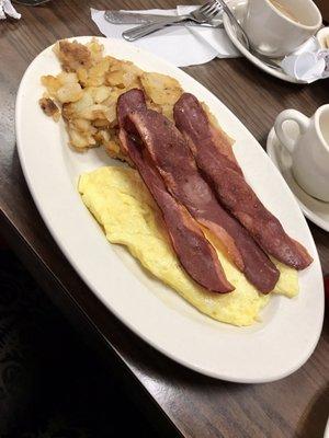 Two scrambled eggs with turkey bacon and home fries.  The eggs were more like an omelette but still yummy!