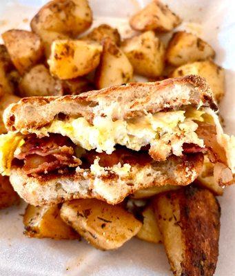 Egg McMo (bacon egg and cheese) on English muffin and crispy home fries