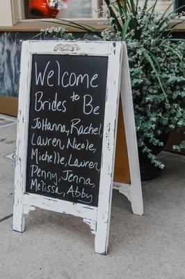 Brides are welcomed to Ellen's by a sign out front. The perfect photo opportunity!