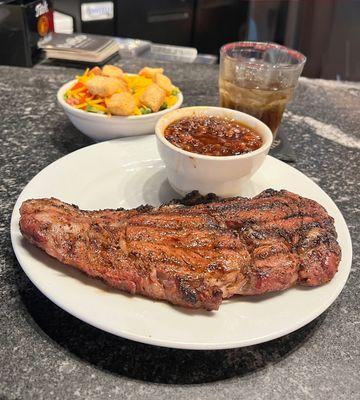 16oz grilled ribeye steak with choice of any two sides.