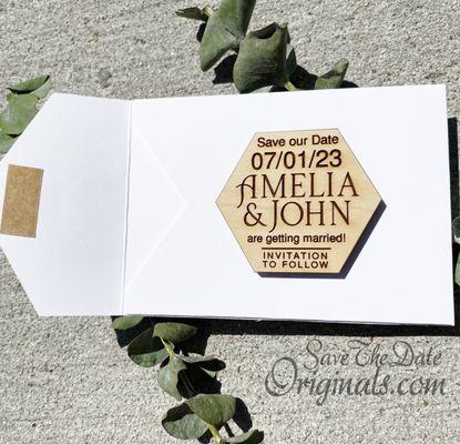 Small laser etched plywood wedding save the date magnet with a card stock envelope.