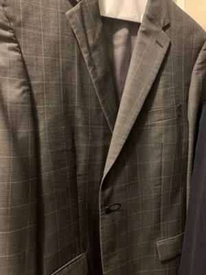 Wrinkles pressed into the jacket. Note the lapel.