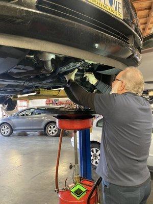 Rafael is replacing performing a transmission service on a Chrysler