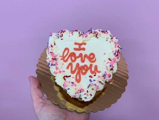 Cookie shaped into a heart, frosted with message for Valentines Day