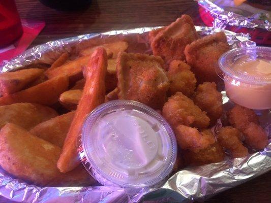 3 deal appetizers : fried cauliflower, ravioli, and seasoned wedges