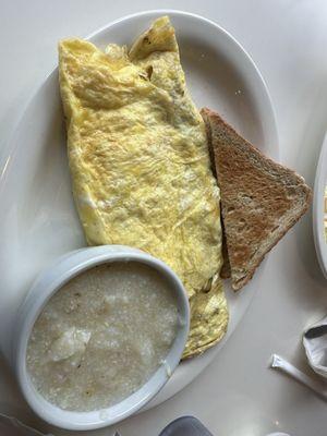 Sausage omelet with grits.