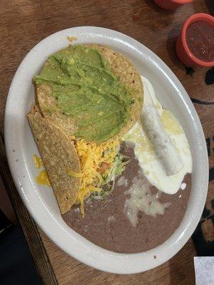 Sour cream enchilada, chicken taco, guacamole tostada