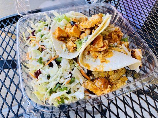 Side Berry Slaw, side jalapeño corn pudding, two Buffalo chicken tacos