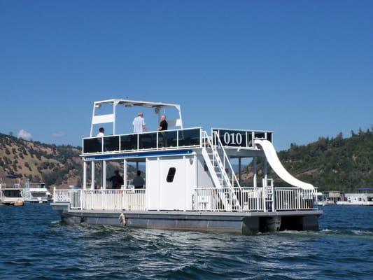 44 ft patio pontoon boat has upper deck, water slide, restroom, and is great for groups up to 15.