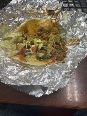 Some sort of mystery meat and grease taco