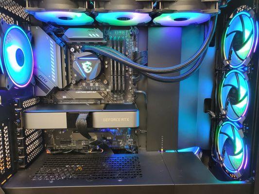 A beautiful custom build. Clean and mostly black, with RGB accents.