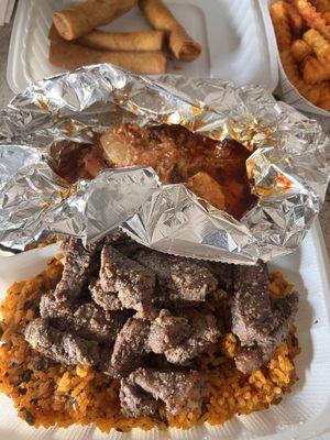 New York Steak and Spicy Shrimp, Pastele lumpia and gandule rice.