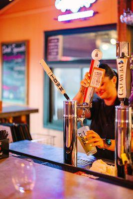 Bar tender pouring beer