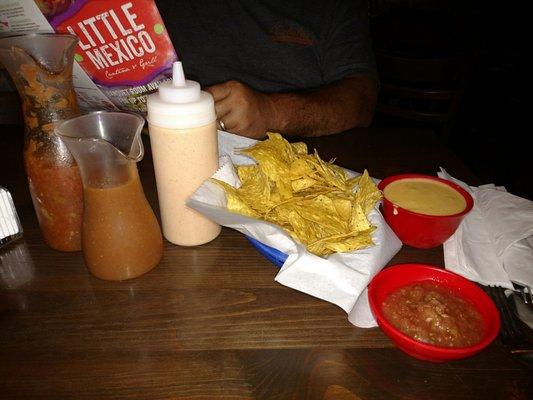 Chips with their original cheese dip, mild and hot  salsa, and their famous sauce thats good on everything!! It's all homemade