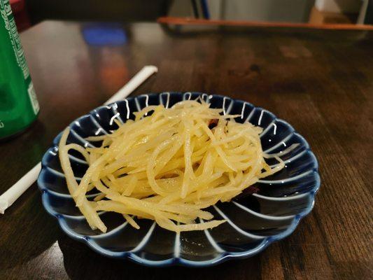 Complimentary side dish with the lunch special - sliced potatoes, a little spicy and tastes good