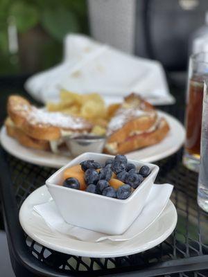 Fresh Fruit, Monte Cristo Sandwich and kettle cooked potato chips.