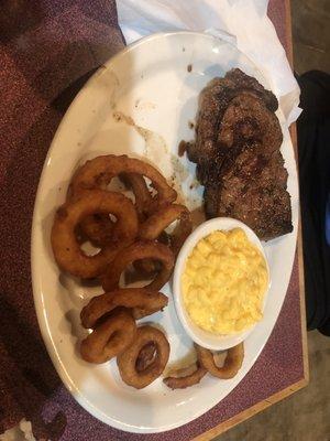 Pete's Ribeye with inion rings and Mac and Cheese. The steak is much bigger than it looks here.