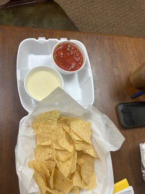 Chip queso cheese dip , salsa