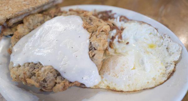 Chicken fried steak with over-easy eggs