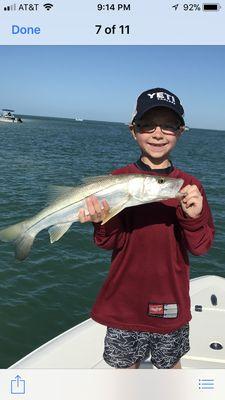 Alex Moore with his very first Snook on his first fishing trip.