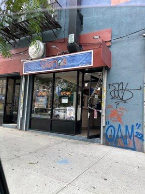 The front of Gino's Fish and chips right next-door to Brooklyn Tonsorial full service Barber & shave studio.