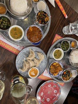 Full spread! (Goat & Chicken Thali, chicken Momos)   (not featured: Threadbare Cider. Went great with this meal as an FYI!)