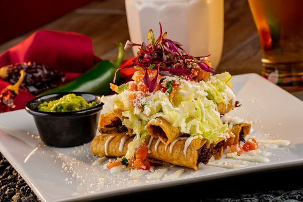 Taquitos, 5 Taquitos with Chicken or beef with sour cream, lettuce, tomato, and guacamole.