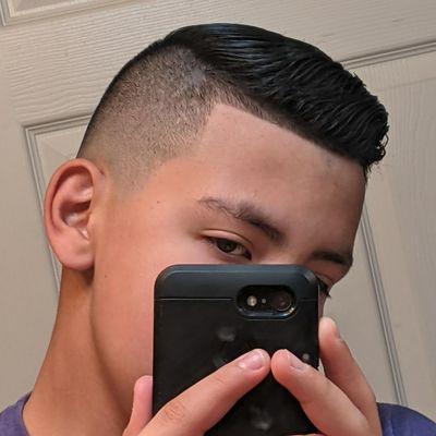 Mid/high fade with comb over.