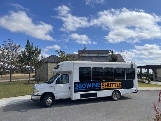 Shuttle bus parked at a winery.