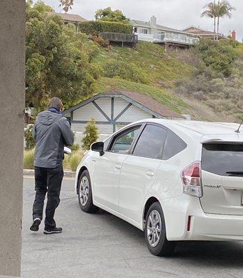 My son (in the car) being quizzed by the examiner!