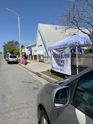 My daughter volunteering today.  Giving out free face mask! Come get yours today.