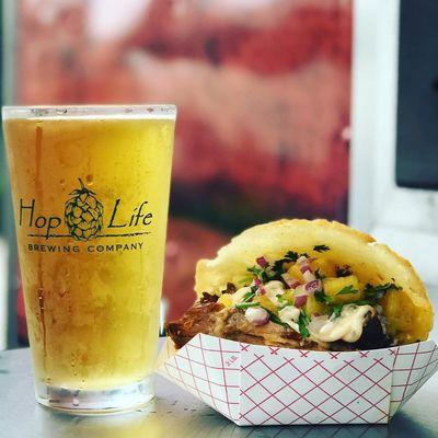 Pork and sweet plantain arepa, fresh pineapple, kimchee aioli, cilantro. It pairs soooo well with hoplife breweries mutha pucker