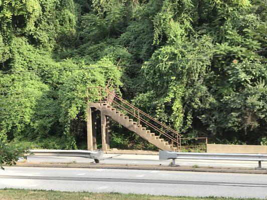 Across Bigelow, another staircase going up. Not sure if still in use, but there are faint markings of a crosswalk on the road. Run fast!