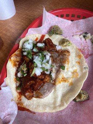 Pork Chile rojo taco with beans