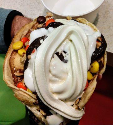 Vanilla Custard, Hot fudge, Marshmallow and Reese's pieces in bubble waffle, yum. $6.49.