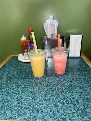 Fresh made bubble tea (mango and Watermelon shown). Flavors of fillings are: Tapioca, Lychee, coconut and Rainbow.