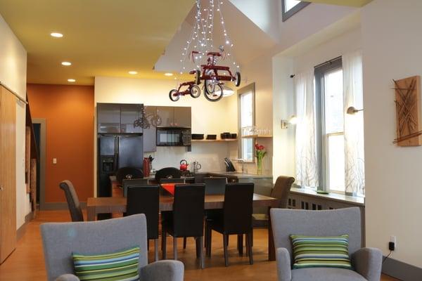 High Gear- interior photo of the living, dining and kitchen area.  There are artistic touches throughout the house!