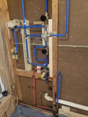 new plumbing for shower 
2 diverter 2 body sprays , i handheld, 1 rain head rough in