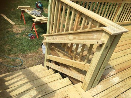 2016 Elmhurst, pressure-treated deck. Notice the necessary graspable railing.